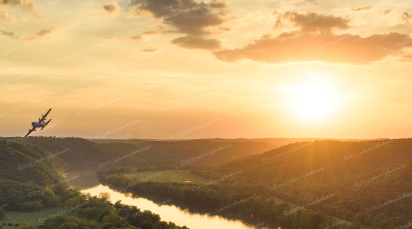 20 C 130 Over The White River At Sunset Near Painters Bluff - Professional New Photography 2026 photography by Paul Caldwell